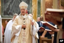 Cardinal Donald Wuerl, Archbishop of Washington, enters church for Mass at St. Mathews Cathedral, Wednesday, August 15, 2018 in Washington. (AP Photo/Kevin Wolf)