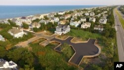 A July 16, 2019 aerial photo shows a wooden road built on pilings in one of the freshwater wetlands in coastal Delaware where the Bethany Beach Firefly, which some environmentalists want added to the federal Endangered Species List, was previously found.