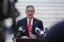 FILE - Georgia Secretary of State Brad Raffensperger gives an update on the state of the election and ballot count during a news conference at the State Capitol in Atlanta, Georgia, Nov. 6, 2020.