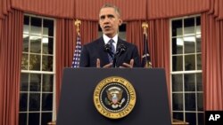President Barack Obama addresses the nation from the Oval Office at the White House in Washington, Sunday night, Dec. 6, 2015. (Saul Loeb/Pool Photo via AP)