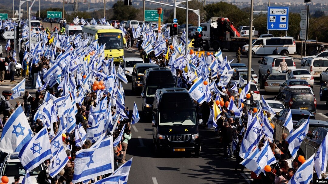 Israelis gather to bid farewell to Shiri, Ariel and Kfir Bibas, in Ashkelon