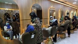 Beauticians put makeup on customers at Ms. Sadat’s Beauty Salon in Kabul, Afghanistan, Sunday, April 25, 2021. Kabul's young working women say they fear their dreams may be short-lived if the Taliban return to Kabul, even if peacefully as part of a new go