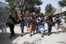 Taliban fighters patrol in the Wazir Akbar Khan neighborhood in the city of Kabul, Afghanistan, Wednesday, Aug. 18, 2021.