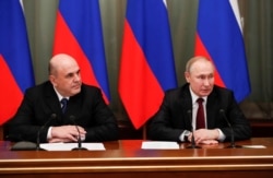 Russian President Vladimir Putin and Prime Minister Mikhail Mishustin hold a meeting with members of the new government in Moscow, Russia January 21, 2020. Sputnik/Dmitry Astakhov/Kremlin via REUTERS