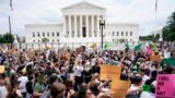 Protesters gather outside the Supreme Court in Washington, Friday, June 24, 2022. The Supreme Court has ended constitutional protections for abortion that had been in place nearly 50 years. (AP Photo/Jacquelyn Martin)