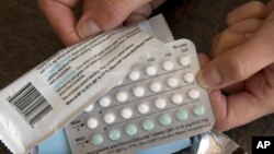 FILE - Birth control pills are displayed in Sacramento, Calif., Aug. 26, 2016. A drug company is seeking U.S. approval for the first-ever birth control pill that women could buy without a prescription. (AP Photo/Rich Pedroncelli, File)