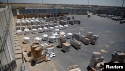 Packages of goods are seen ahead of their transfer to the Gaza Strip, inside the Kerem Shalom border crossing terminal between Israel and Gaza Strip, Israel, Aug. 15, 2018.