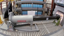 This Thursday, Feb. 23, 2012, file photo provided by the U.S. Navy, shows an electromagnetic railgun prototype launcher at the Naval Surface Warfare Center, Dahlgren Division test facility in Dahlgren, Va. (U.S. Navy photo by John F. Williams via AP, File