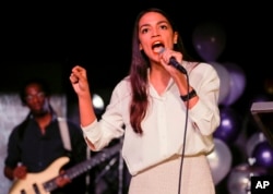 New York Democratic Congressional candidate Alexandria Ocasio-Cortez speaks to supporters, Tuesday, Nov. 6, 2018 in Queens, New York, after defeating Republican challenger Anthony Pappas in the race for the 14th Congressional district.