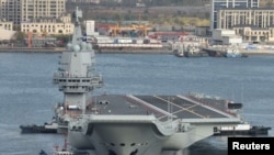 中國自製航母“山東艦”2019年11月14日駛出大連港開始第九次海試。
