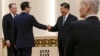 2019年2月15日北京人民大会堂: 美国财政部长姆努钦(左二)与中国国家主席习近平握手