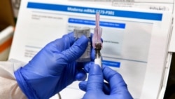 In this file photo, a nurse prepares a shot that is part of COVID-19 vaccine developed by the National Institutes of Health and Moderna Inc., in Binghamton, New York, July 27, 2020. (AP)