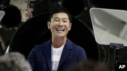 Japanese billionaire Yusaku Maezawa speaks after SpaceX founder and chief executive Elon Musk announced him as the person who would be the first private passenger on a trip around the moon, Monday, Sept. 17, 2018, in Hawthorne, Calif.