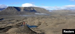 General view shows fossil-bearing rocks, where the 250 million year-old fossils of the earliest-known ichthyosaur, a type of marine reptile that flourished during the age of dinosaurs, where found, in the remote Arctic island of Spitsbergen, Norway, in this undated handout image obtained by Reuters on March 14, 2023. (Benjamin Kear/Handout via REUTERS)