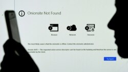 This photo illustration shows a screen displaying the Darkside onionsite address with a notice saying it could not be found, in Arlington, Virginia on May 14, 2021. (AFP)