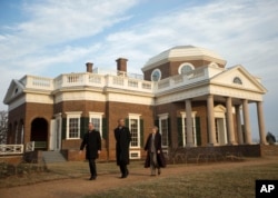 President Barack Obama and French President Francois Hollande tour the grounds of Monticello, President Thomas Jefferson's estate in Charlottesville, Virginia, Feb. 10, 2014.