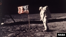 Astronaut Edwin E. "Buzz" Aldrin Jr. poses for a photograph beside the U.S. flag deployed on the moon during the Apollo 11 mission on July 20, 1969. (AP Photo/NASA/Neil A. Armstrong)