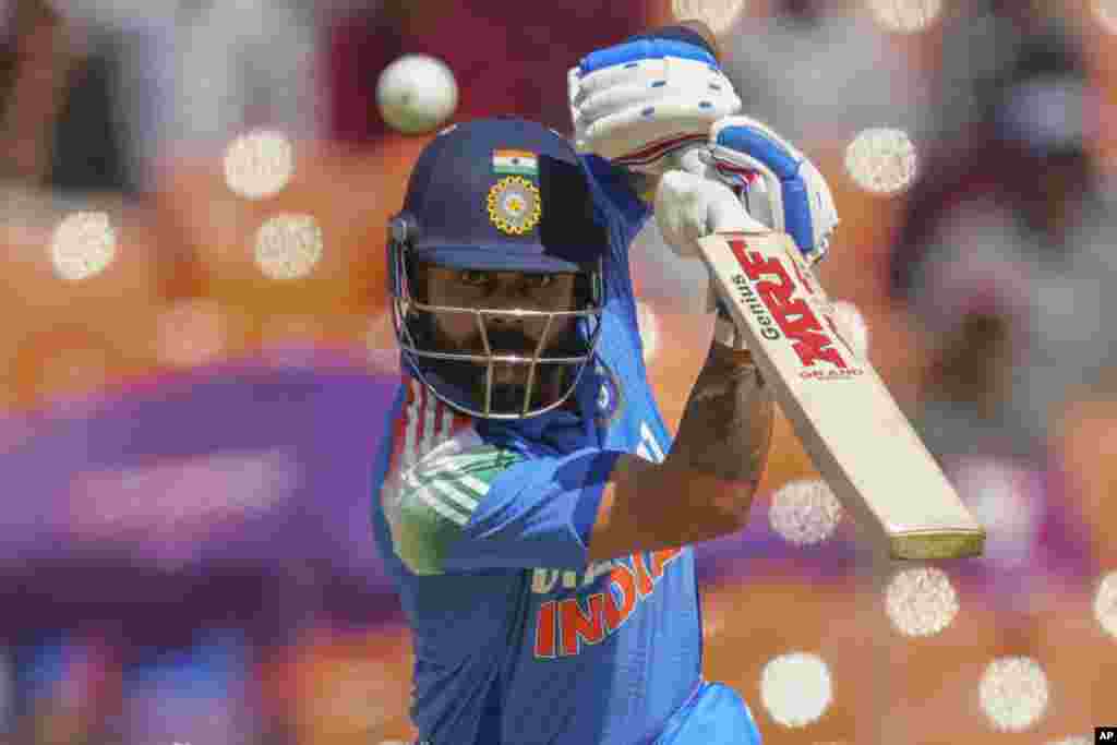 India's Virat Kohli plays a shot during the third one day international cricket match between India and England in Ahmedabad, India. (AP Photo/ Ajit Solanki)