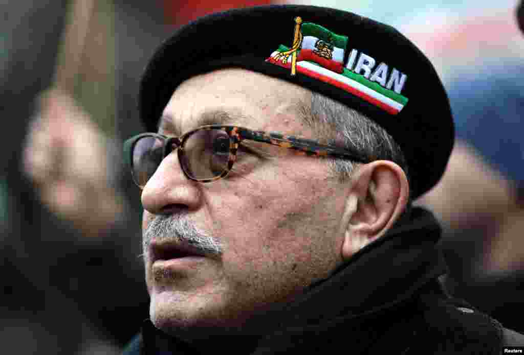 Opponents of Iranian President Hassan Rouhani hold a protest outside the Iranian embassy in west London, Britain, Jan. 2, 2018.