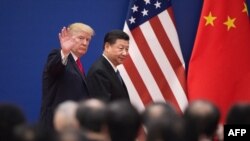 U.S. President Donald Trump and China's President Xi Jinping leave a business leaders event at the Great Hall of the People in Beijing, Nov. 9, 2017.