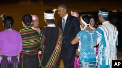 President Barack Obama is greeted upon his arrival on Air Force One at Naypyitaw International Airport, Nov. 12, 2014, in Naypyitaw, Myanmar.