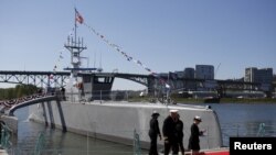 The autonomous ship Sea Hunter, developed by the Pentagon's Defense Advanced Research Projects Agency, is shown docked after its christening ceremony in Portland, Oregon, April 7, 2016.