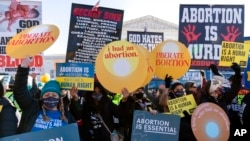 Protesters for and against abortion rights demonstrate in front of the U.S. Supreme Court, Dec. 1, 2021, in Washington. (AP Photo/Jose Luis Magana)