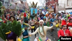 FILE - Members of the Mondo Kayo Social and Marching Club march during the Krewe of Zulu parade at Mardi Gras in New Orleans, Louisiana U.S., February 28, 2017. (REUTERS/Shannon Stapleton)