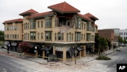 A building is partially collapsed due to a 6.0-magnitude earthquake, Sunday, Aug. 24, 2014, in Napa, California.