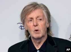 FILE - Paul McCartney poses for photographers at a film premiere in London, December 12, 2022. (Photo by Scott Garfitt/Invision/AP, File)