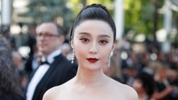 FILE - Fan Bingbing poses for photographers as she arrives for the screening of the film "The Beguiled" at the 70th international film festival, Cannes, southern France, May 24, 2017.