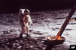 Astronaut Edwin Aldrin, the second man on the moon, walks by the footpad of the Apollo 11 Lunar Module. July, 1969. (AP/Photo, NASA file)
