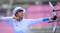 South Korea's An San competes in the women's individual during the Tokyo 2020 Olympic Games at Yumenoshima Park Archery Field in Tokyo on July 30, 2021. (Photo by ADEK BERRY / AFP)
