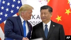 资料图片。美国总统特朗普和中国国家主席习近平2019年6月日本举行会晤。