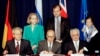 President Slobodan Milosevic of Serbia (L), President Alija Izetbegovic of Bosnia-Herzegovina (C) and President Franjo Tudjman of Croatia sign the Dayton Agreement peace accord at the Hope Hotel inside Wright-Patterson Air Force Base in this November 21, 