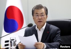 South Korean President Moon Jae-in presides over the national security council at the Presidential Blue House in Seoul, South Korea, November 29, 2017.