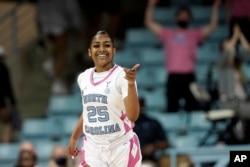 FILE - Deja Kelly at the University of North Carolina has six deals, including Dunkin’ Donuts and Outback Steakhouse. (AP Photo/Gerry Broome, File)