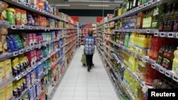 A customer shops in a supermarket in Nice, France, Jan. 16, 2017.