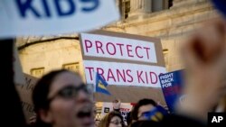 Activists and protesters with the National Center for Transgender Equality rally in front of the White House, Feb. 22, 2017.