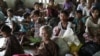Local residents take refuge in a monastery compound in Sittwe, the capital of Rakhine state in western Myanmar, where sectarian violence continues to impact the public, Wednesday, June 13, 2012. Heavy rain Wednesday brought an uneasy calm to western Myanm
