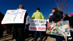 Supporters hold up a placard during a rally in for Jeanette Vizguerra, a Mexican woman seeking to avoid deportation from the United States, outside the Immigration and Customs Enforcement office in Centennial, Colo.