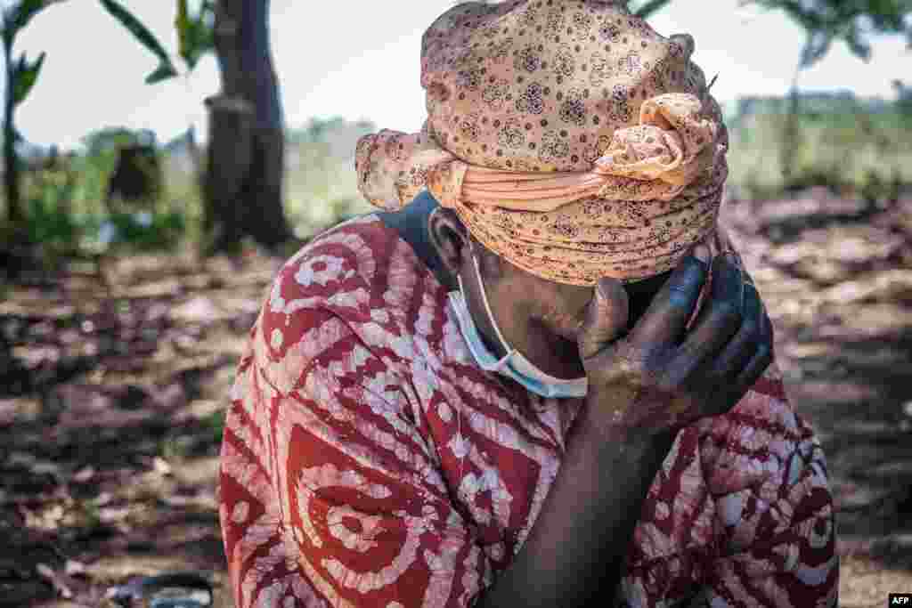 A woman in Lukodi town, Uganda, where dozens were killed in 2004 by the Lord&#39;s Resistance Army, weeps as she listens to Dominic Ongwen&#39;s verdict on the radio.&nbsp;The International Criminal Court in The Hague, Netherlands, convicted the child soldier-turned-Lord&#39;s Resistance Army commander, of war crimes and crimes against humanity.