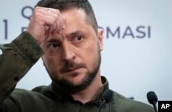 Ukrainian President Volodymyr Zelenskyy attends a news conference after the Crimea Platform Summit in Kyiv, Ukraine, Tuesday, Aug. 23, 2022. (AP Photo/Andrew Kravchenko)