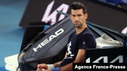Novak Djokovic of Serbia attends a practice session ahead of the Australian Open tennis tournament in Melbourne on Jan. 14, 2022. (Photo by MARTIN KEEP / AFP)