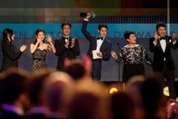 The cast of "Parasite" accepts the award for Outstanding Performance by a Cast in a Motion Picture at the Screen Actors Guild. REUTERS/Mario Anzuoni