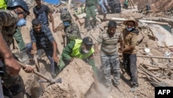 Emergency personnel continue rescue operations in the mountainous area of Tizi N'Test, in the Taroudant province, one of the most devastated in quake-hit Morocco, on September 11, 2023. (Photo by BULENT KILIC / AFP)