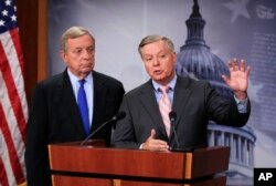 Senator Lindsey Graham, R-South Carlina, right, with Sen. Dick Durbin, D-Illinois, speaks during a news conference on September 5, 2017.