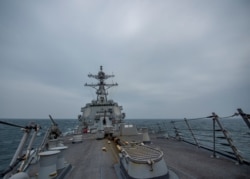 United States Navy Arleigh Burke-class guided-missile destroyer USS John Finn (DDG 113) transits the Taiwan Strait March 10, 2021 in this handout provided by the U.S. Navy. (Jason Waite/U.S. Navy/Handout via REUTERS)