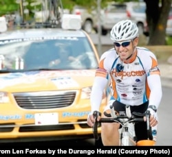 Len Forkas cycles during the 2012 Race Across America. He finished 10th in 2012 and won his age division. He started his charity HopeCam when his son Matt was diagnosed with cancer in 2002. His son is now a college graduate and does not have cancer.