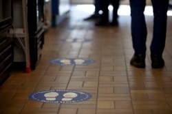 Store with floor markings to show social distancing